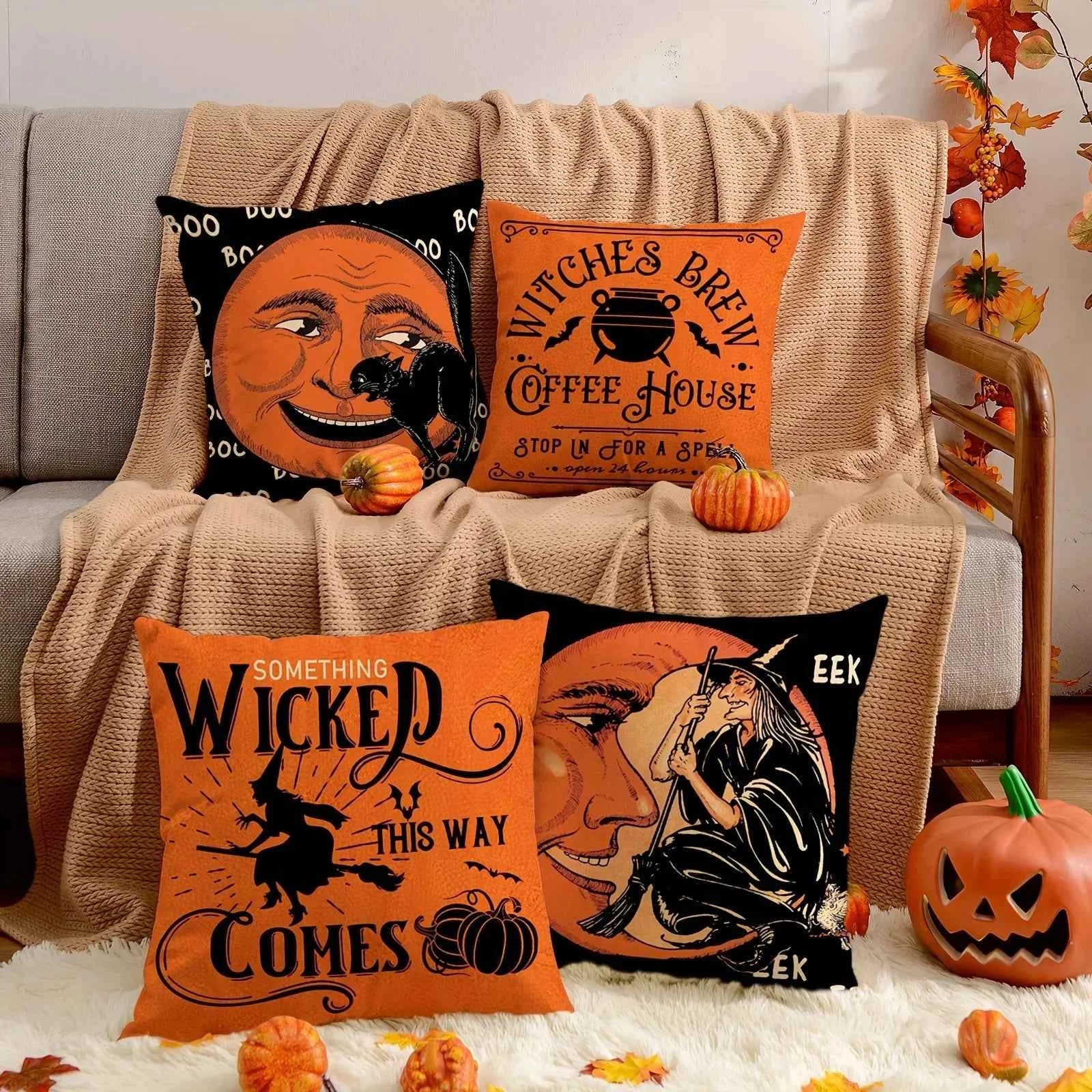 Halloween-themed pillows on a couch with pumpkins and autumn leaves.