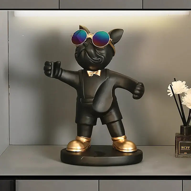 French Bulldog wine bottle holder in a stylish design with sunglasses and gold accents on a shelf.