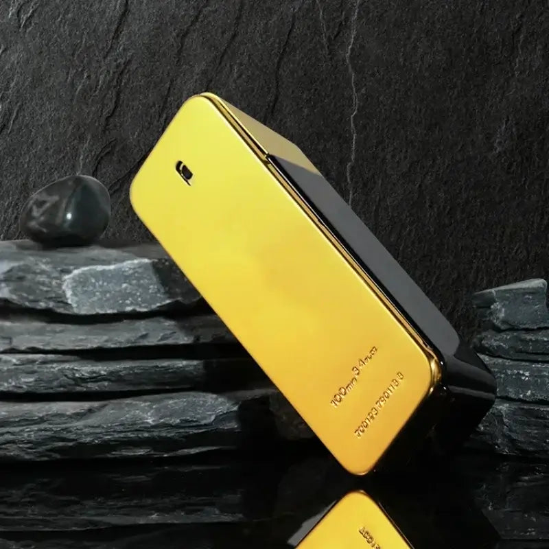 luxury men's eau de parfum bottle displayed on a textured stone surface, showcasing its elegant gold design.