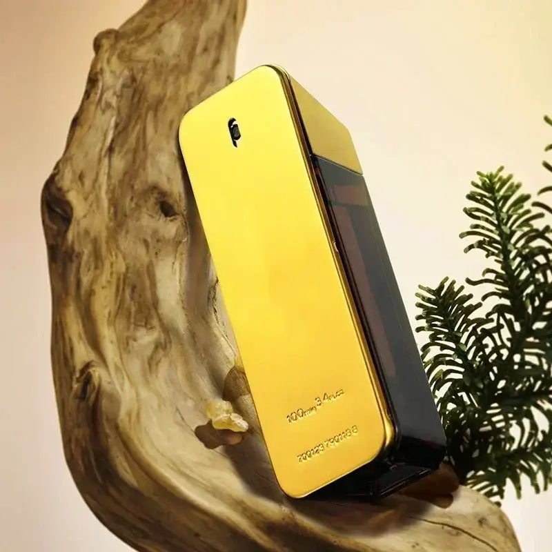 Luxury men's eau de parfum bottle displayed on decorative wood, showcasing its elegant gold and black design.