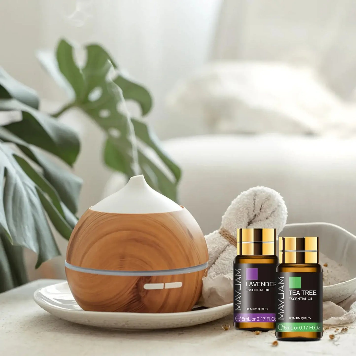 aromatherapy essential oils gift set featuring a diffuser and lavender and tea tree essential oils for relaxation.