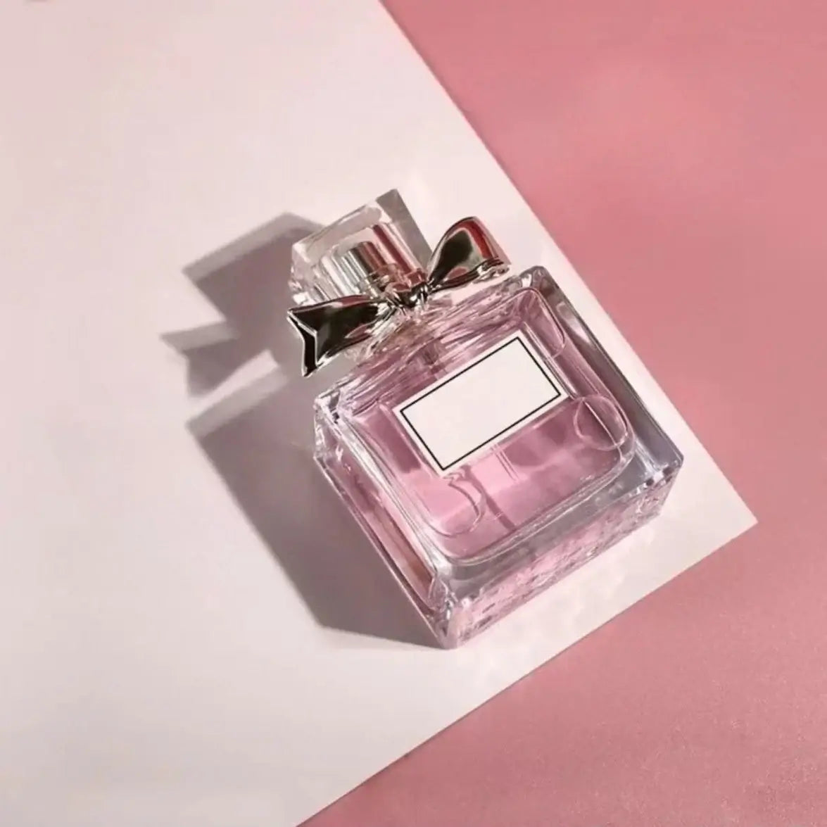 Women's Floral Body Spray 100ml - Long-Lasting Romantic Perfume in elegant bottle on pink background.