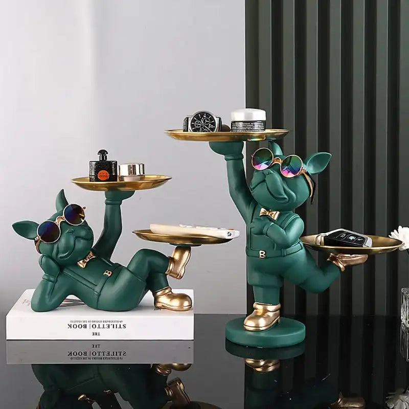 Green pig statue with gold accents and sunglasses, holding trays.